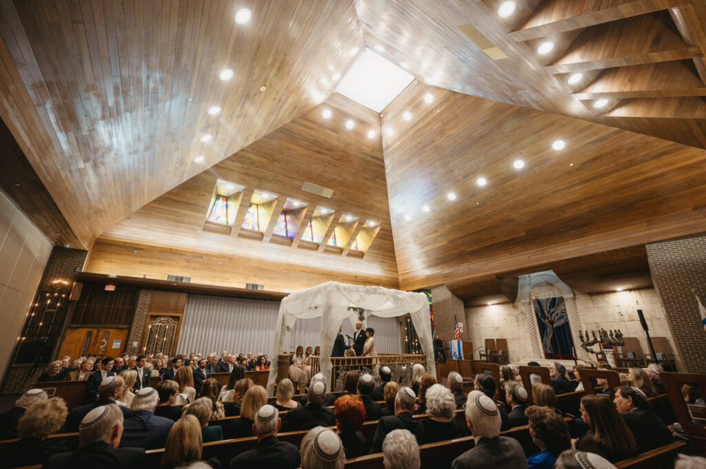 interior of the synagogue with a chuppah in the center